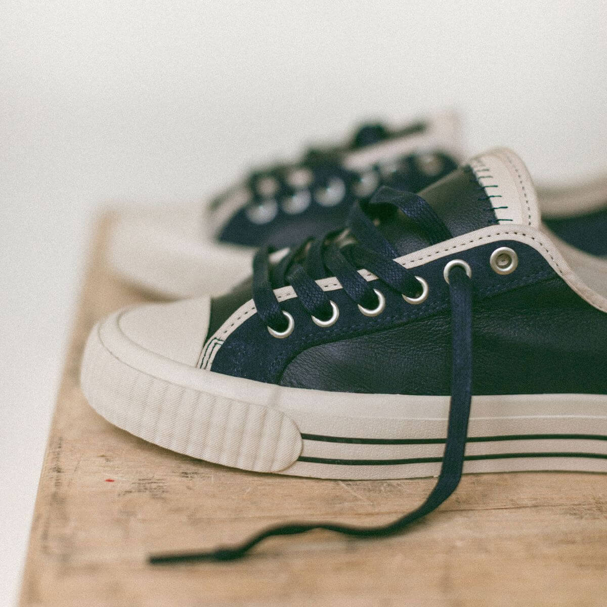 Navy low-top leather sneakers