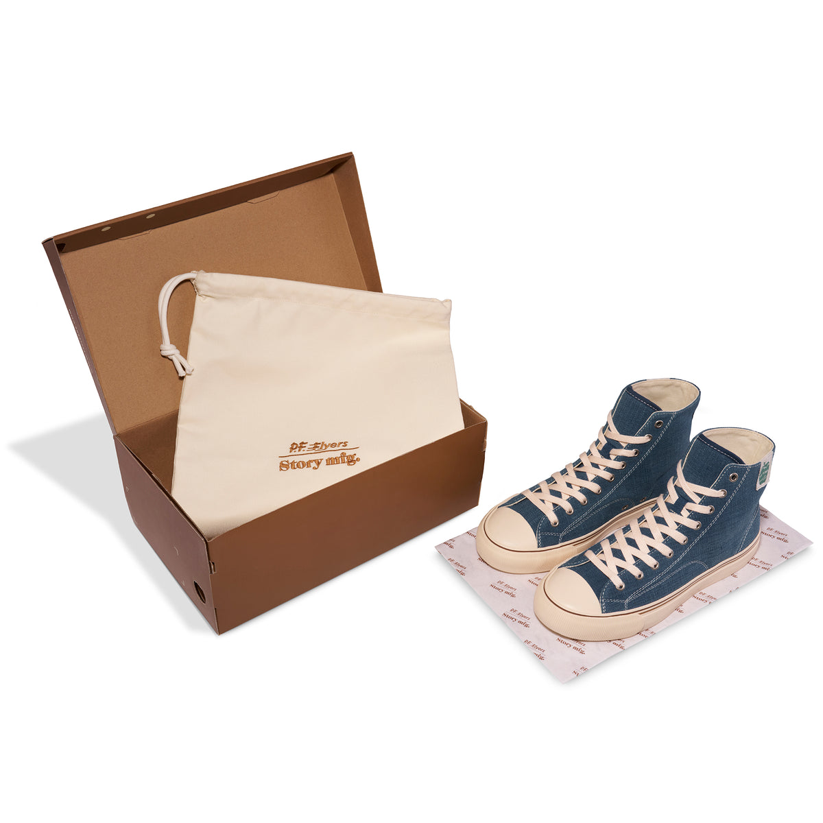 Indigo high-top sneaker next to a shoebox on a white background.