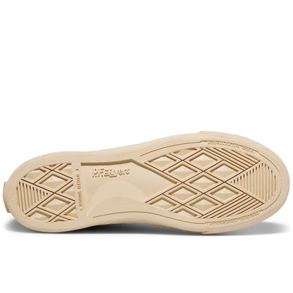 A beige shoe sole with a geometric pattern on a white background.