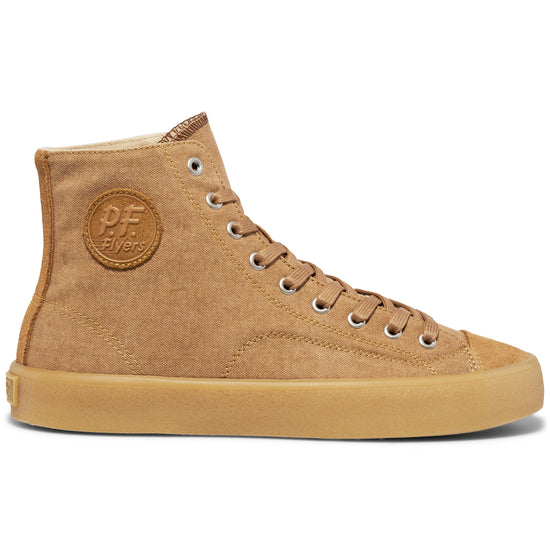 Tan high-top sneaker on a white background.
