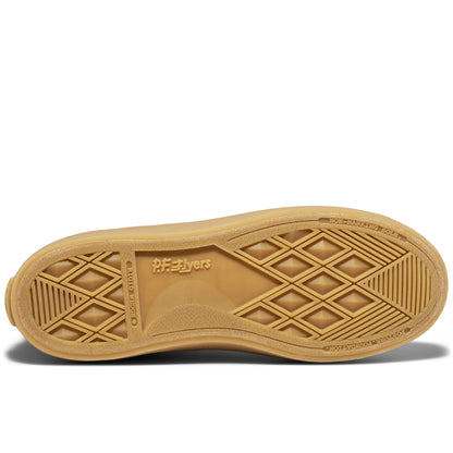 A tan shoe sole with a geometric pattern on a white background.