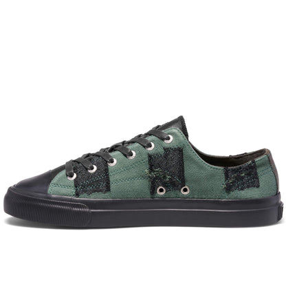 Green and black sneaker on a white background