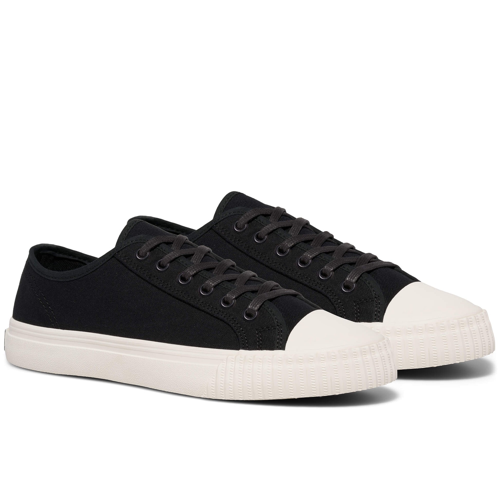 Pair of black sneakers with white soles on a white background.