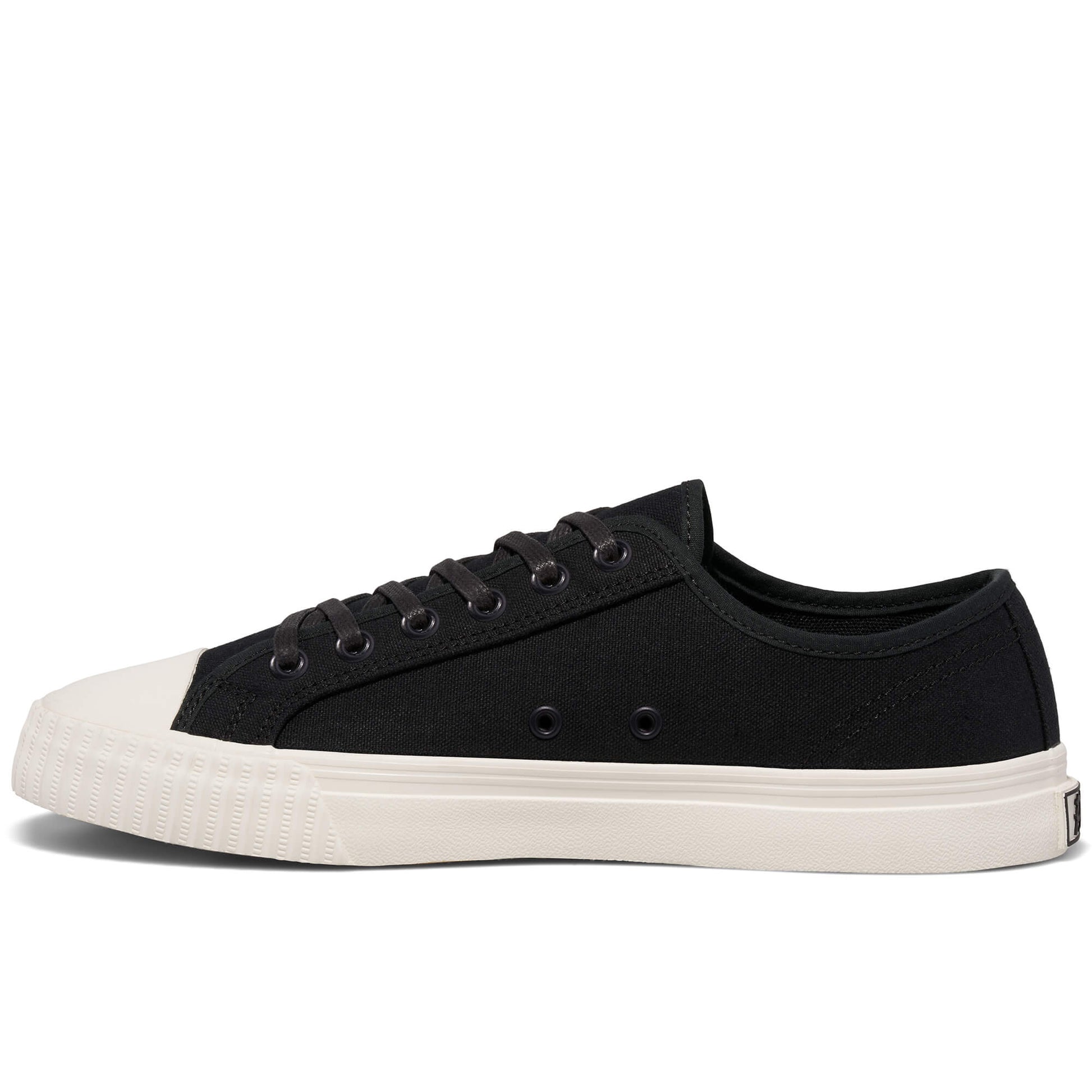 Black low-top sneaker with white sole on a white background.
