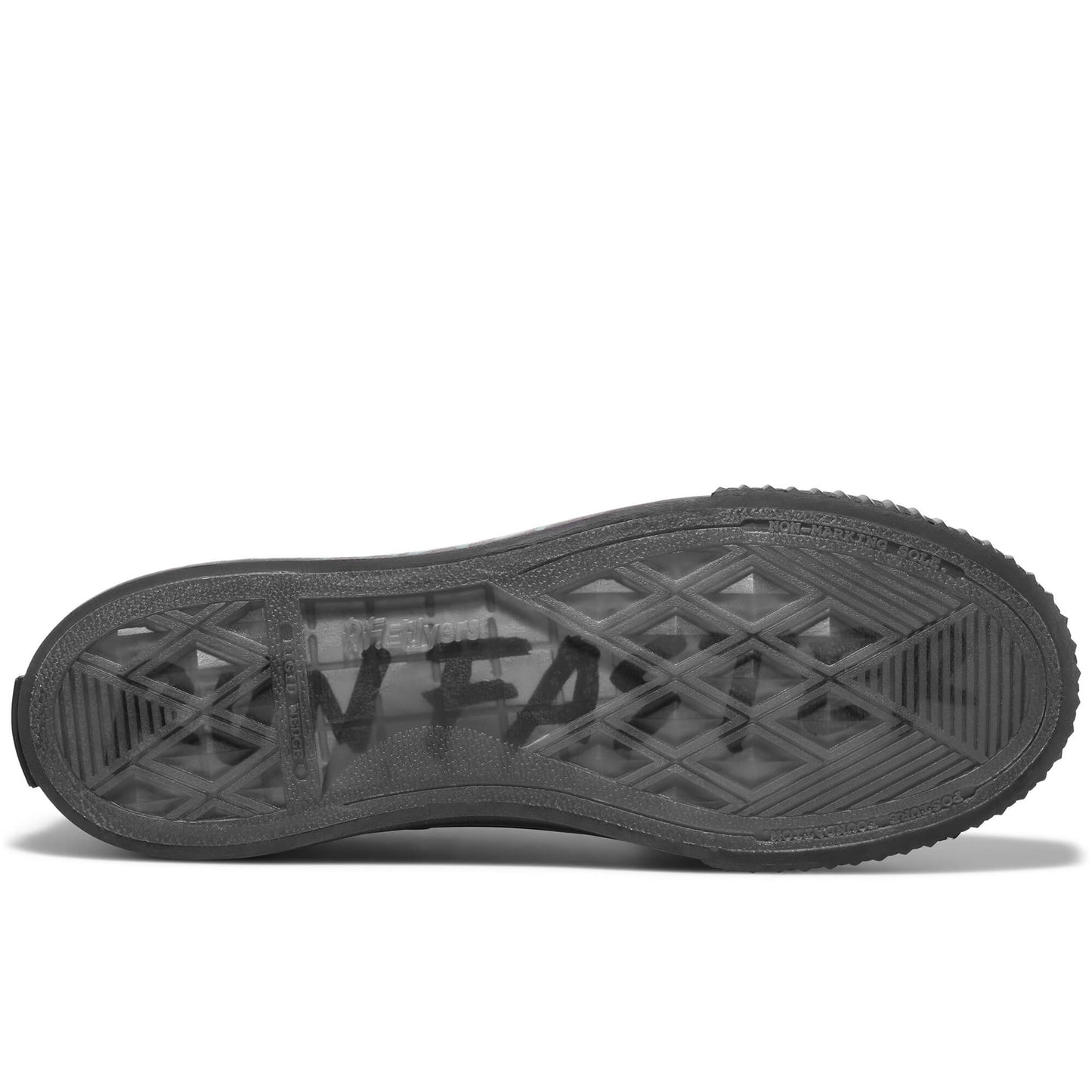 Black sole of a sneaker on a white background, with “Run Faster” printed on the sole.