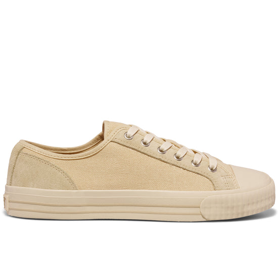 Beige low-top sneaker on a white background.