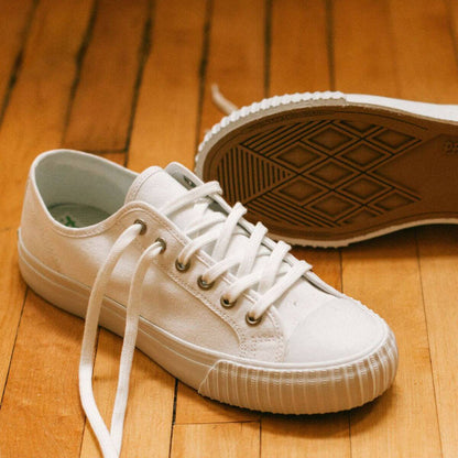 All white low-top retro sneakers