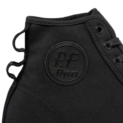 Close-up of a black P.F. Flyers logo on a high-top sneaker against a white background.