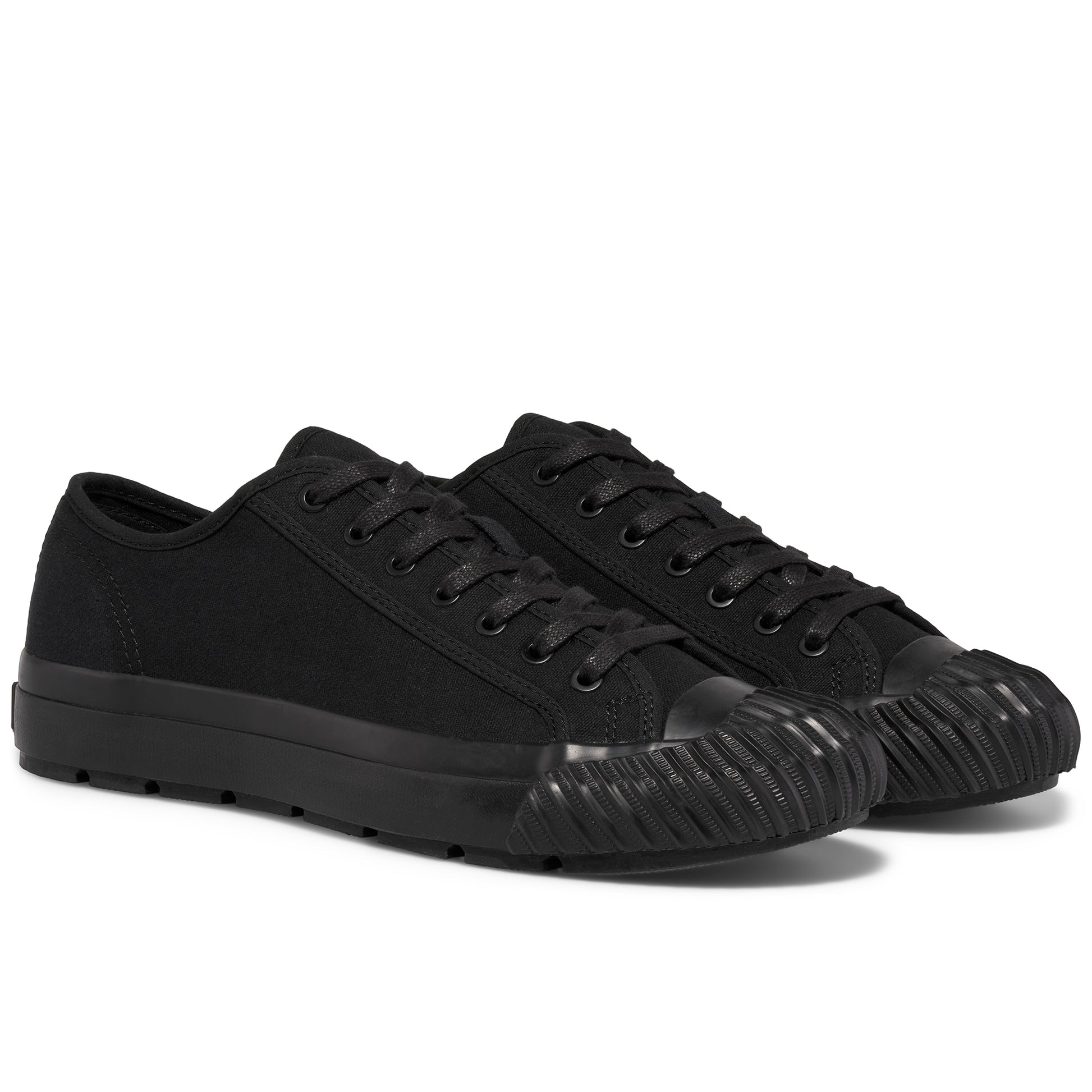 Pair of black low-top sneakers on a white background.