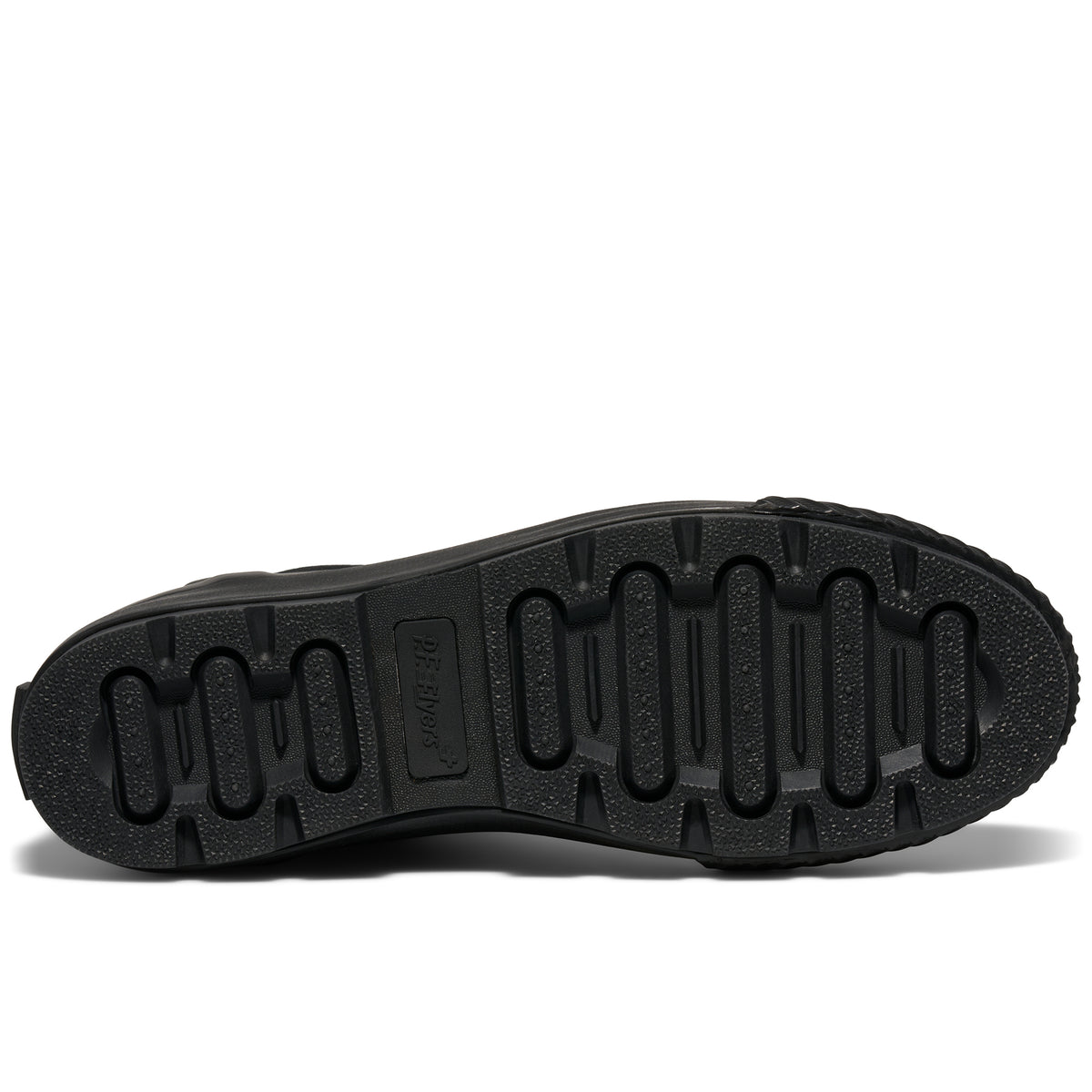 A shoe's black rubber outsole set against a plain white background.