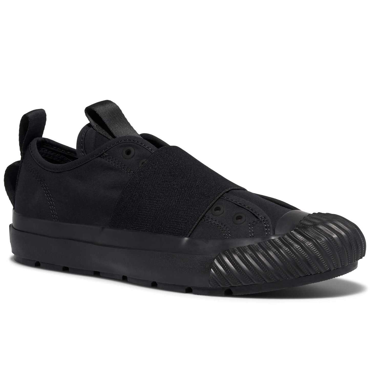 Black slip-on sneaker with a textured sole on a white background