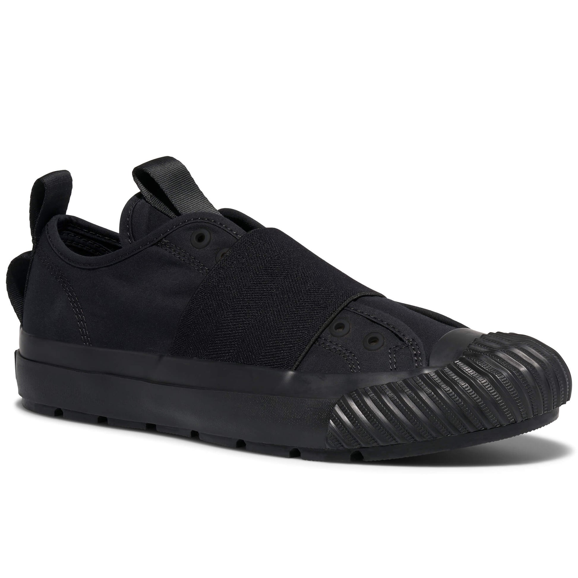 Black slip-on sneaker with a textured sole on a white background