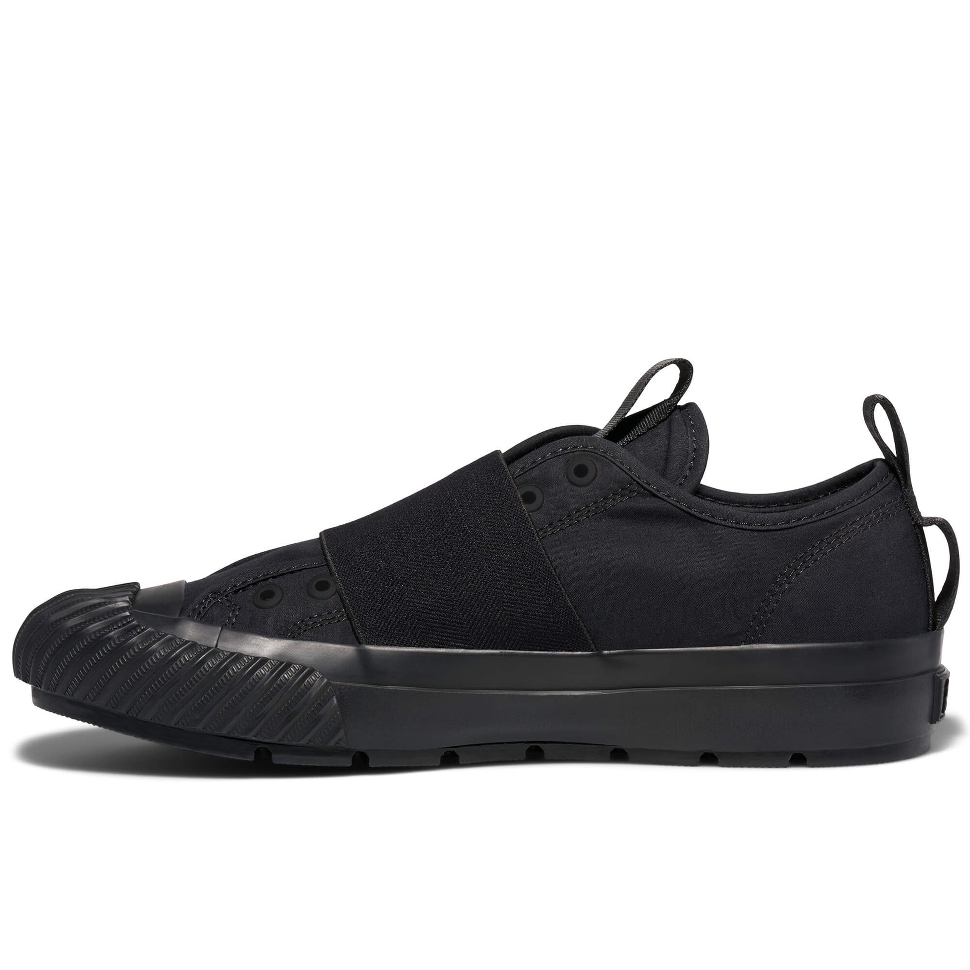Black sneaker with a thick sole on a white background