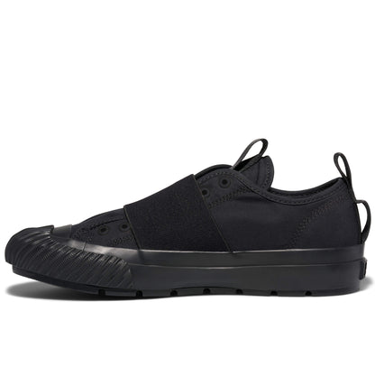 Black sneaker with a thick sole on a white background