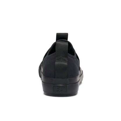 Black slip-on sneaker on a white background