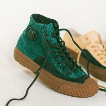Green and brown high-top sneakers with a visible brand logo on a white background