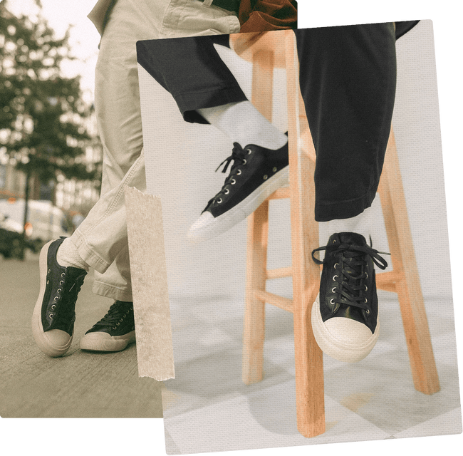 Person wearing black low-top sneakers with white soles sitting on a wooden stool.