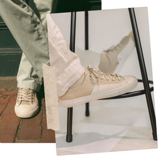 Beige sneakers worn with light-colored pants on a blurred background